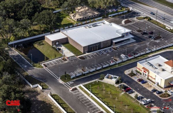Aerial view of Case Contracting commercial property with parking lot and landscaped area.