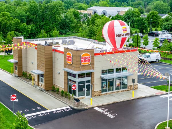 Newly opened Burger King with vibrant decor and a hot air balloon advertisement.