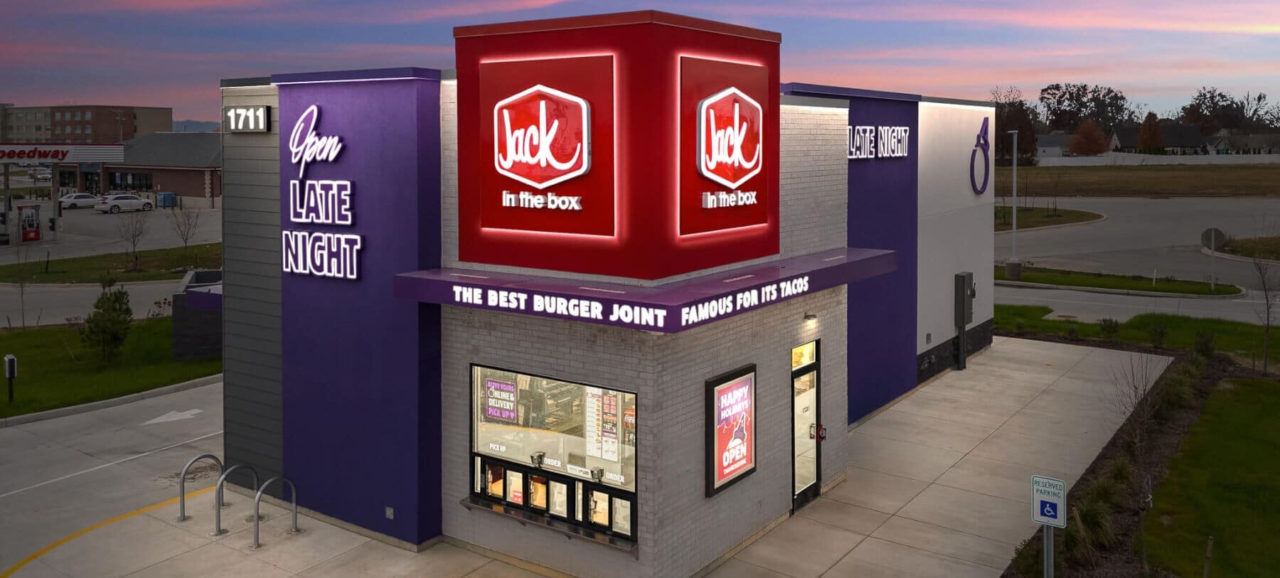 Late-night Jack in the Box restaurant exterior showcasing vibrant signage. Perfect spot for burgers.