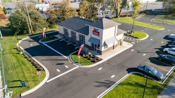 Aerial view of Valvoline Instant Oil Change center, showcasing parking lot and service bays.