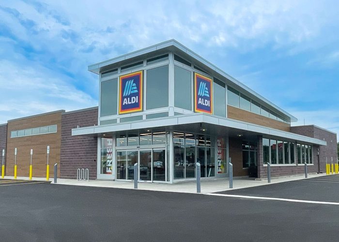 Exterior view of an Aldi store with clear skies. Perfect for shopping deals.
