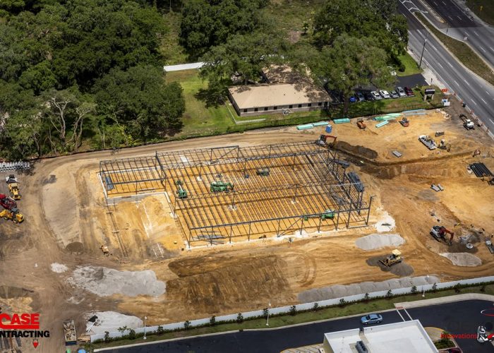 Aerial view of construction site with steel framework in progress by Case Contracting.