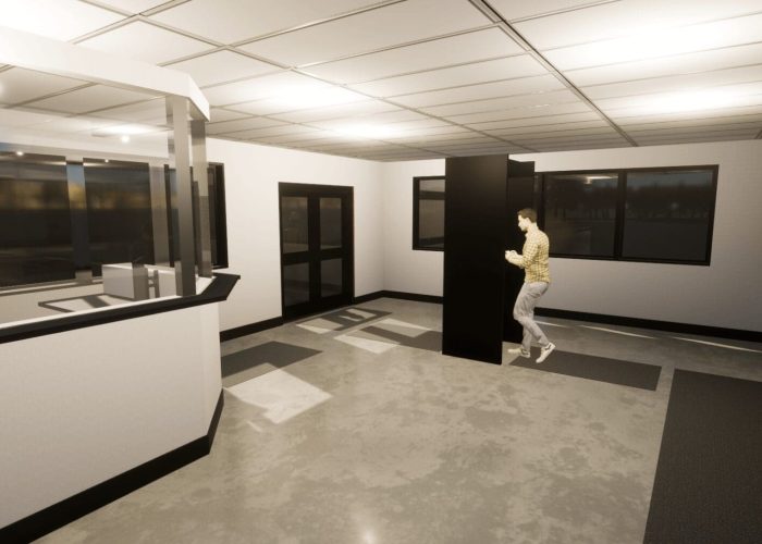 Modern office lobby with a man walking, showcasing ample space and clean design.