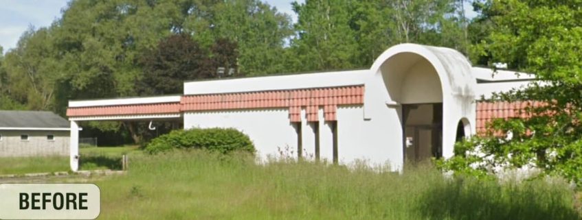 Before renovation: A dated commercial building with a flat roof and overgrown surroundings, marked for transformation.