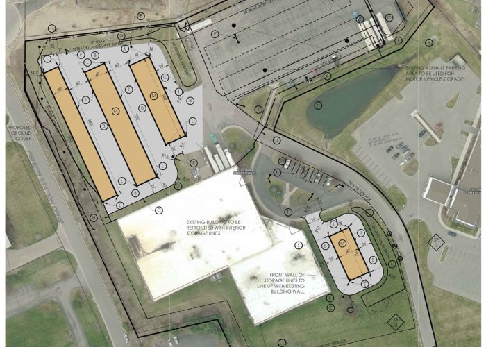 Proposed site plan for industrial storage facility with vehicle parking in urban area redevelopment project.