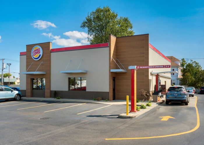Burger King restaurant exterior with drive-thru for fast food pickup on a sunny day.