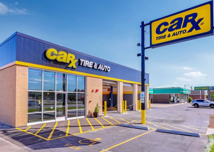 CarX Tire & Auto service center exterior on a sunny day, highlighting the building and sign for auto repair services.